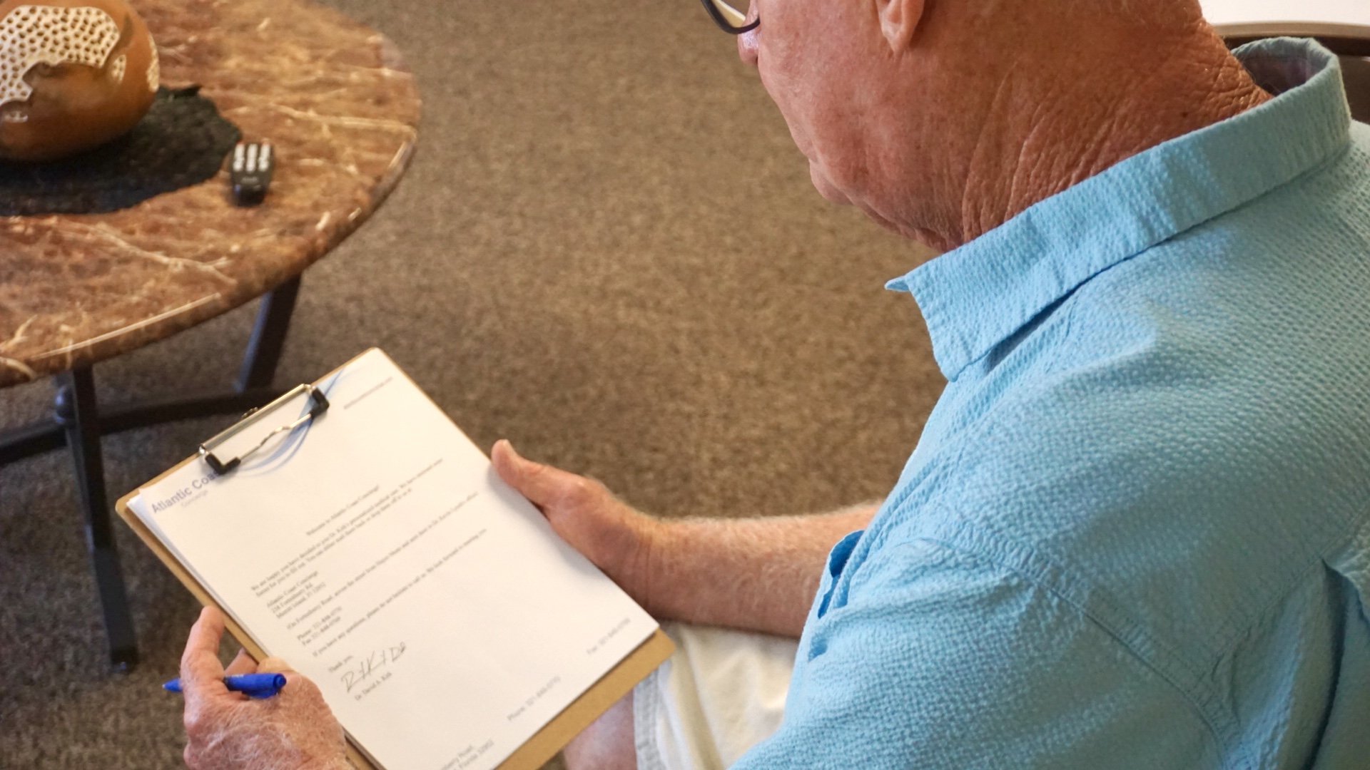 Man Filling Out Paperwork
